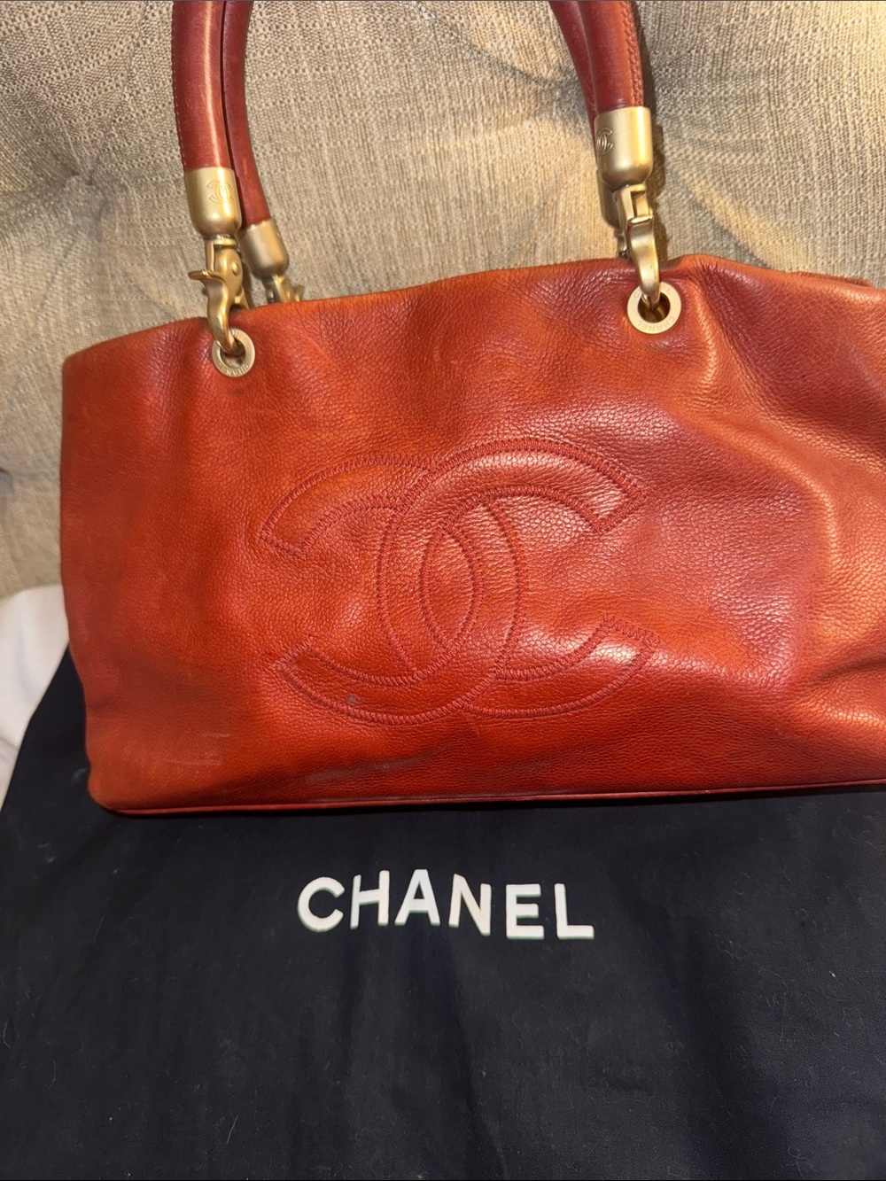 CHANEL Red Leather Shoulder Bag with Embossed CC